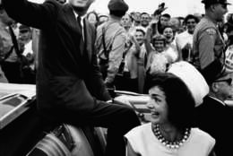 Shortly after his acceptance of the Democratic Party endorsement for President. Senator (and future US President) John F. Kennedy (1917 - 1963) and his wife, future First Lady Jacqueline Kennedy (1929 - 1994), smiles and waves from the back of an open-top car, Massachusetts, July 1960. (Photo by Paul Schutzer/The LIFE Picture Collection/Getty Images)