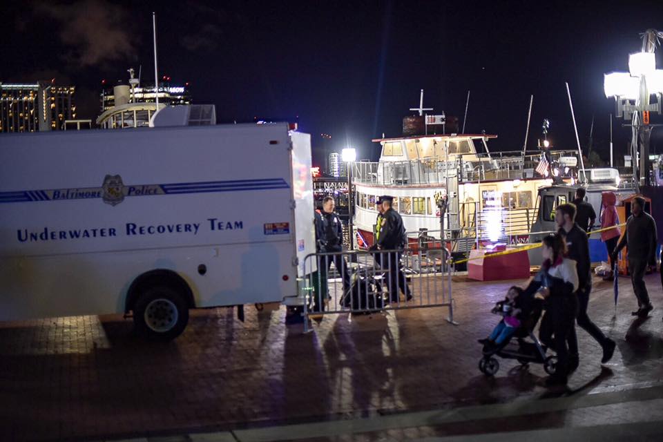 Police at the Baltimore Inner Harbor working to retrieve an ATM in the water. (Courtesy Baltimore police)