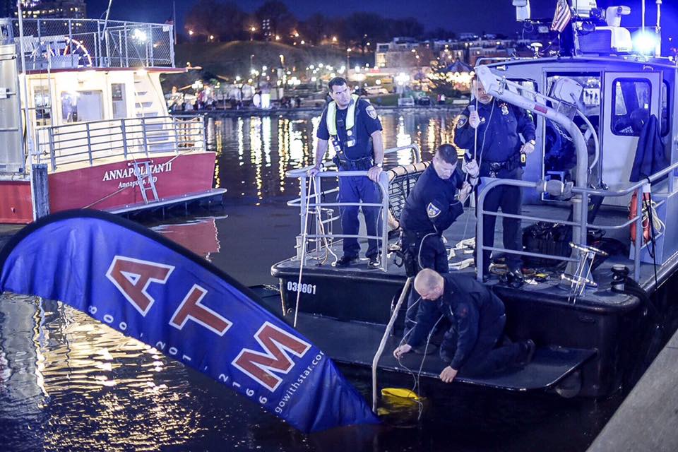 Baltimore Police Department’s marine unit responded Thursday evening and pulled the ATM out of the water. (Courtesy Baltimore police)