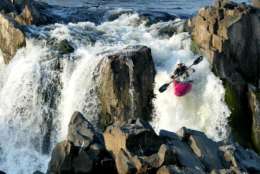A local kayaker cools off  making his way through a roaring set of rapids Monday, Aug. 19, 2002, at Great Falls in northern Virginia. (AP Photo/Ron Edmonds)