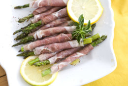 Prosciutto-wrapped grilled spring asparagus is seen in this photo taken Monday, March 5, 2012 in Concord, N.H. (AP Photo/Matthew Mead)