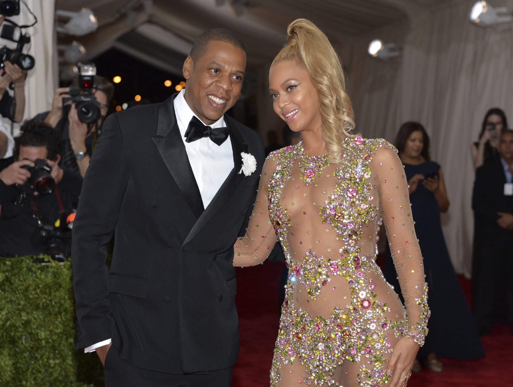 File - In this May 4, 2015, file photo, Jay Z, left, and Beyonce arrive at The Metropolitan Museum of Art's Costume Institute benefit gala celebrating "China: Through the Looking Glass" in New York. The couple dressed as Barbie and Ken for Halloween in photos posted on Instagram Nov. 1, 2016. (Photo by Evan Agostini/Invision/AP, File)
