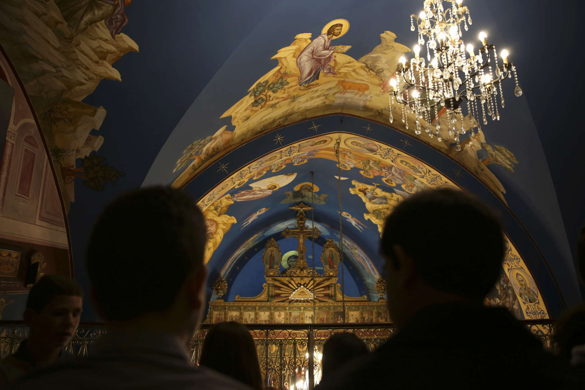Orthodox Christian worshippers attend a prayer during the Easter Eve service at the St. Porphyrios church in Gaza City, Saturday, April 15, 2017. Christians have gathered at the church for the fire ceremony that celebrates Jesus' resurrection. (AP Photo/Adel Hana)