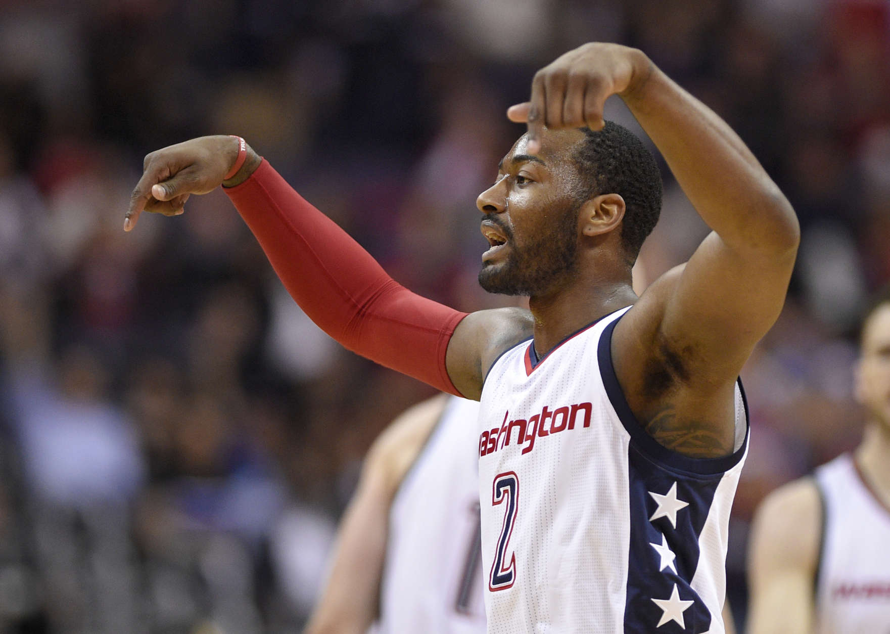 Washington Wizards guard John Wall (2) gestures after a basket during the second half in Game 5 of the team's first-round NBA basketball playoff series against the Atlanta Hawks, Wednesday, April 26, 2017, in Washington. The Wizards won 103-99. (AP Photo/Nick Wass)