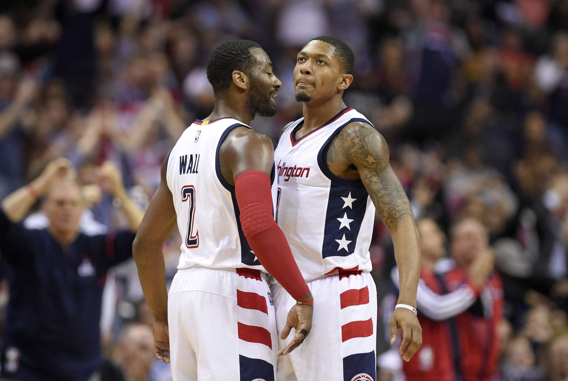 Washington Wizards guards John Wall (2) and guard Bradley Beal chest-bump during the second half in Game 5 of the team's first-round NBA basketball playoff series against the Atlanta Hawks, Wednesday, April 26, 2017, in Washington. The Wizards won 103-99. (AP Photo/Nick Wass)
