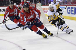 Washington Capitals left wing Alex Ovechkin (8), of Russia, chases the puck against Pittsburgh Penguins right wing Patric Hornqvist (72), of Sweden, during Game 1 of an NHL hockey Stanley Cup second-round playoff series, Thursday, April 27, 2017, in Washington. (AP Photo/Nick Wass)