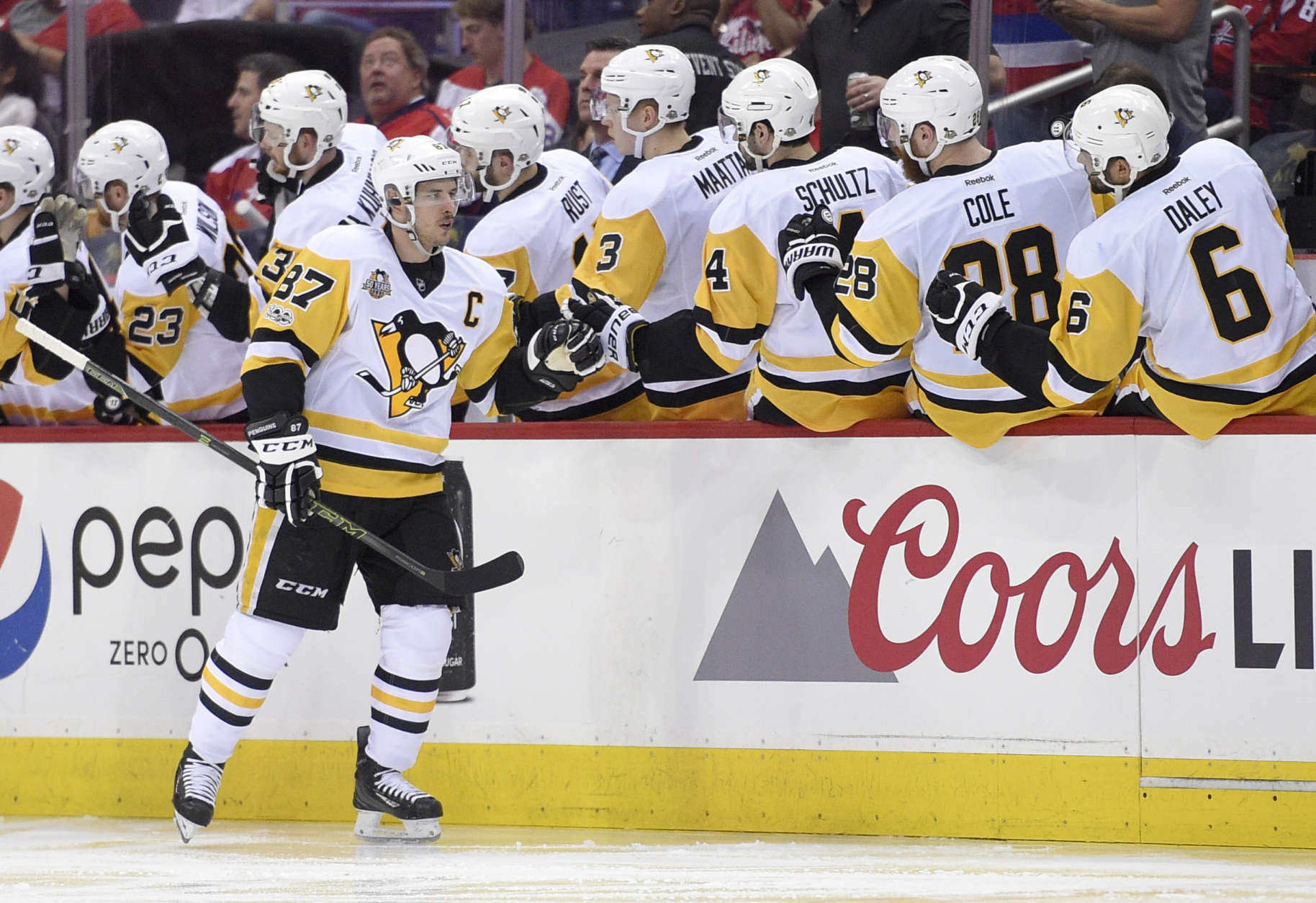 Pittsburgh Penguins center Sidney Crosby (87) celebrates his goal with the bench during the second period of Game 1 of the team's NHL hockey Stanley Cup second-round playoff series against the Washington Capitals, Thursday, April 27, 2017, in Washington. (AP Photo/Nick Wass)