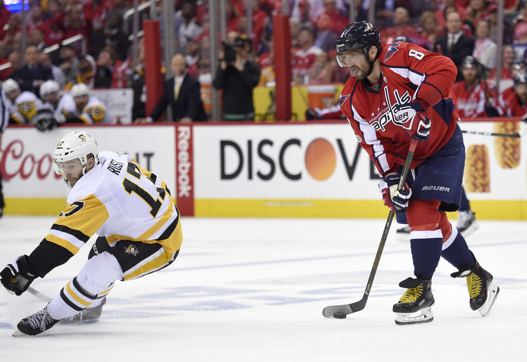 Washington Capitals left wing Alex Ovechkin (8), of Russia, skates with the puck against Pittsburgh Penguins right wing Bryan Rust (17) during the second period of Game 1 in an NHL hockey Stanley Cup second-round playoff series, Thursday, April 27, 2017, in Washington. (AP Photo/Nick Wass)