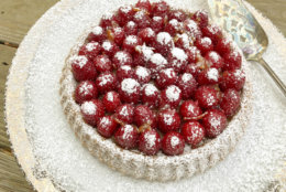This Dec. 4, 2017 photo shows an orange and raspberry tart in Bethesda, Md. This dish is from a recipe by Melissa d'Arabian. (Melissa d'Arabian via AP)