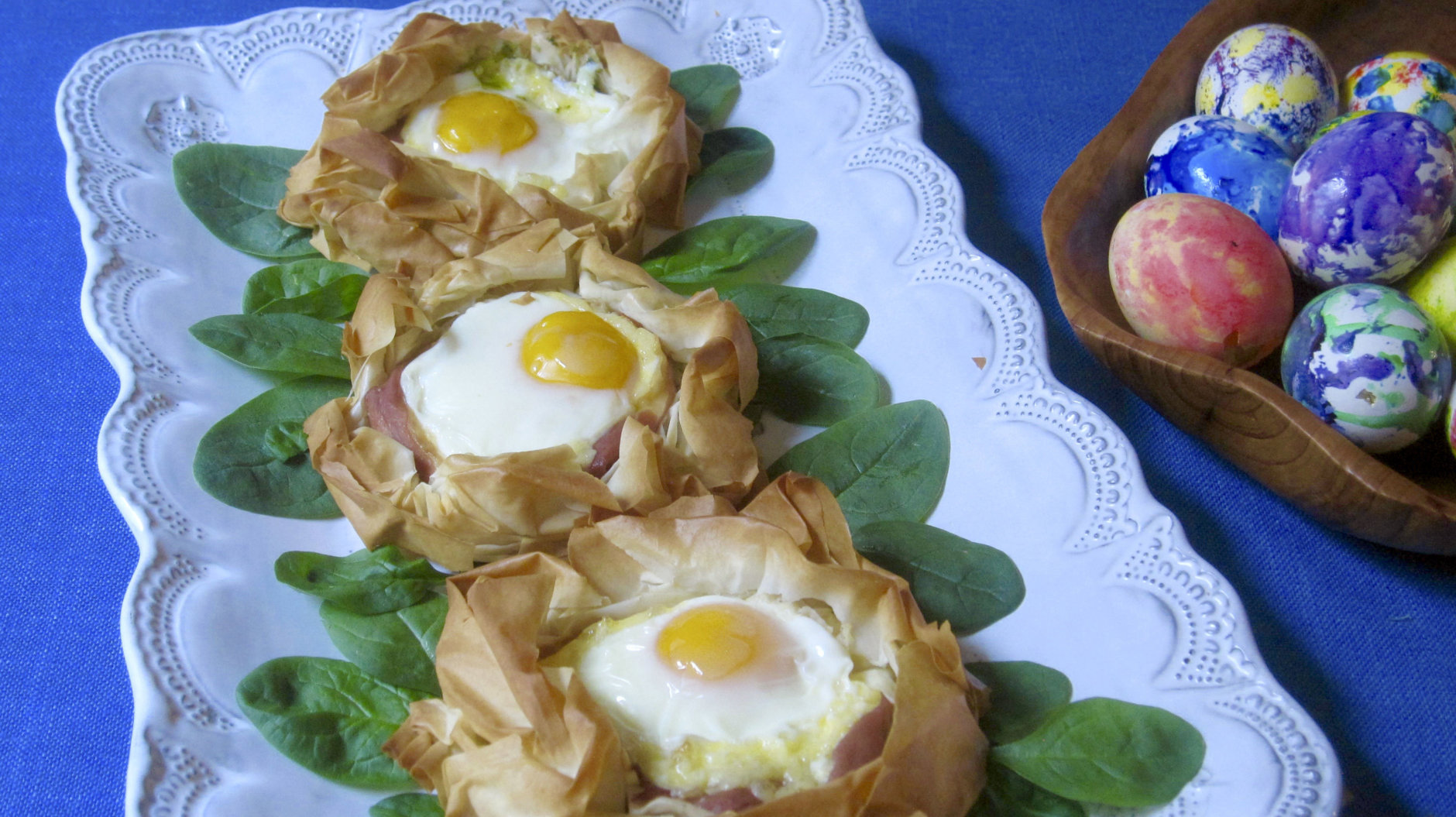 This March 2018 photo shows eggs baked in pastry nests made of phyllo in New York. This dish is from a recipe by Sara Moulton. (Sara Moulton via AP)
