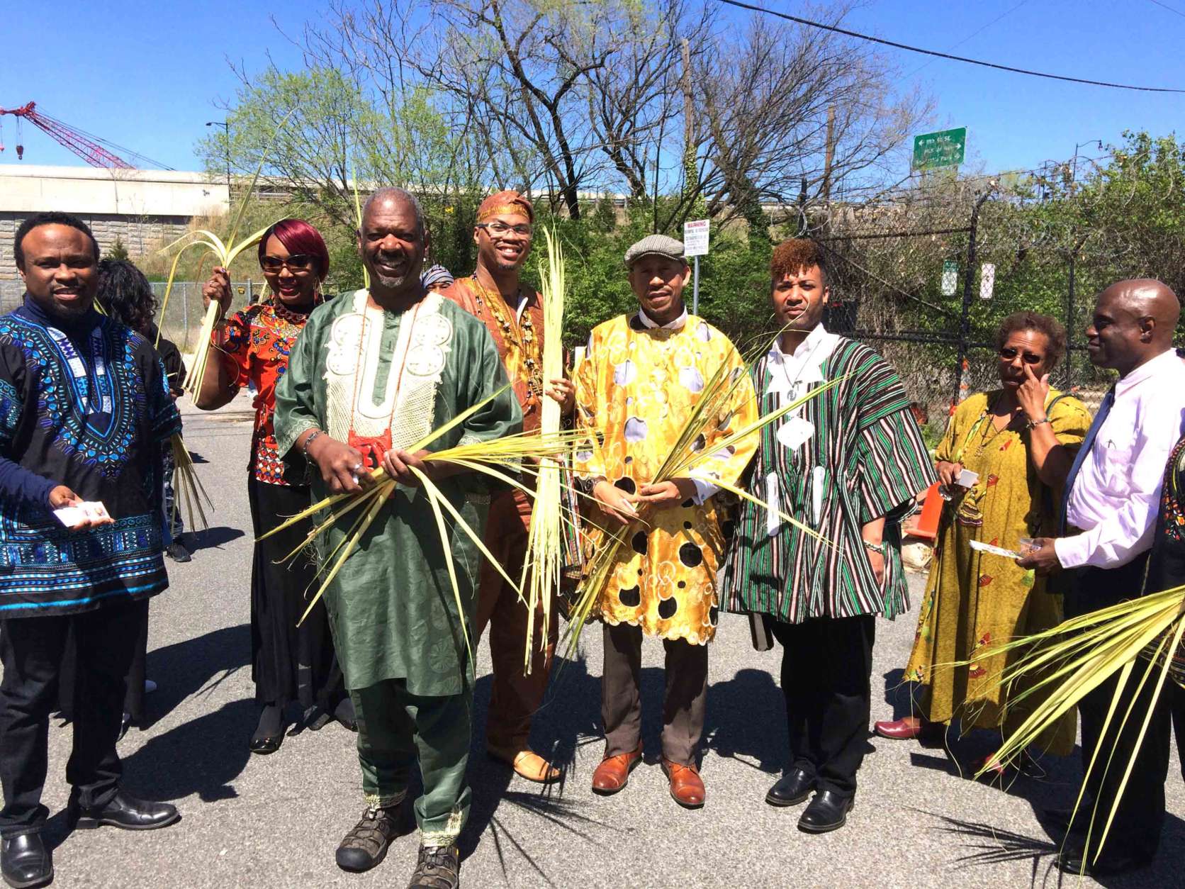 Bishop Rainey Cheeks of Inner Light Ministries Church of Southeast D.C. and some of his congregants handed out palm fronds to commemorate Palm Sunday during the third annual Anacostia River Festival on Sunday. (WTOP/Dick Uliano)