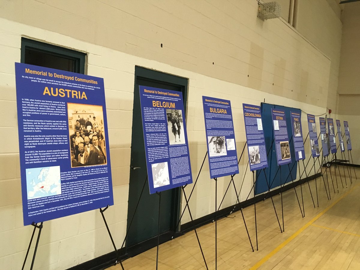 Information boards at the Jewish Community Center of Northern Virginia gym told the story of countries where 20,000 Jewish communities were destroyed. (WTOP/Liz Anderson)