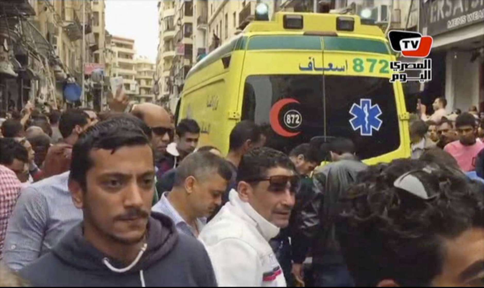 This frame grab from video shows an ambulance outside Saint Mark's Cathedral following a suicide bombing that killed several people, just after Coptic Pope Tawadros II finished services, in the coastal city of Alexandria, Egypt, Sunday, April 9, 2017. Bombs tore through two Egyptian churches in different cities as worshippers were marking Palm Sunday, both claimed by the Islamic State group. (AL-MASRY AL-YOUM, via AP)