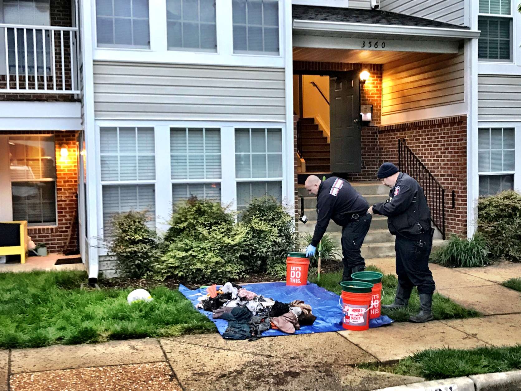 Homicide and fire investigators are trying to determine why a man was found unconscious when they arrived to fight an overnight apartment fire in Prince William County. (WTOP/Neal Augenstein)