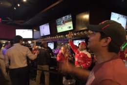 Capitals fans at the Green Turtle in D.C. cheer a goal during Game 5 against the Pittsburgh Penguins on  Saturday, May 7, 2017. (WTOP/Jenny Glick)
