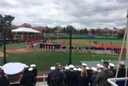 The Nationals and the Red Sox stand for the national anthem at the Naval Academy. (WTOP/George Wallace)