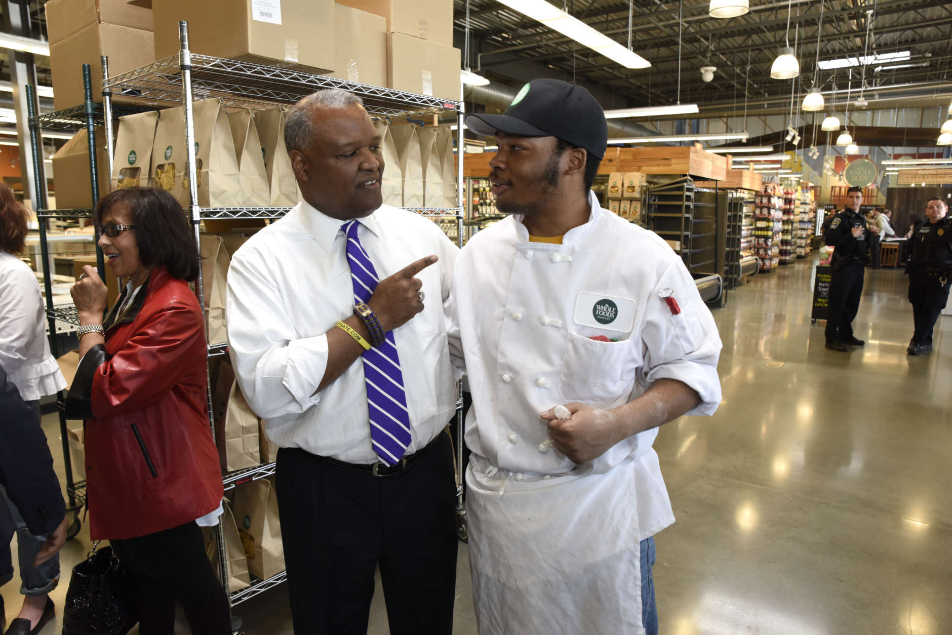 On Sunday's soft opening, County Executive Rushern Baker meets Timothy Alexander, the Whole Foods Riverdale Pizza Guy. (Courtesy Mike Yourishin)