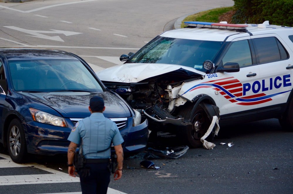 There were no serious injuries in this crash between a car and a D.C. police cruiser Saturday. (WTOP/Dave Dildine)