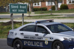 A Prince George's County, Md. Police vehicle is seen near the location where a military aircraft crashed, Wednesday, April 5, 2017, in Clinton, Md. Air Force officials said in a statement Wednesday that the D.C. Air National Guard F-16C crashed in southwest of Joint Base Andrews. Officials say the pilot ejected and is safe. (AP Photo/Sait Serkan Gurbuz)
