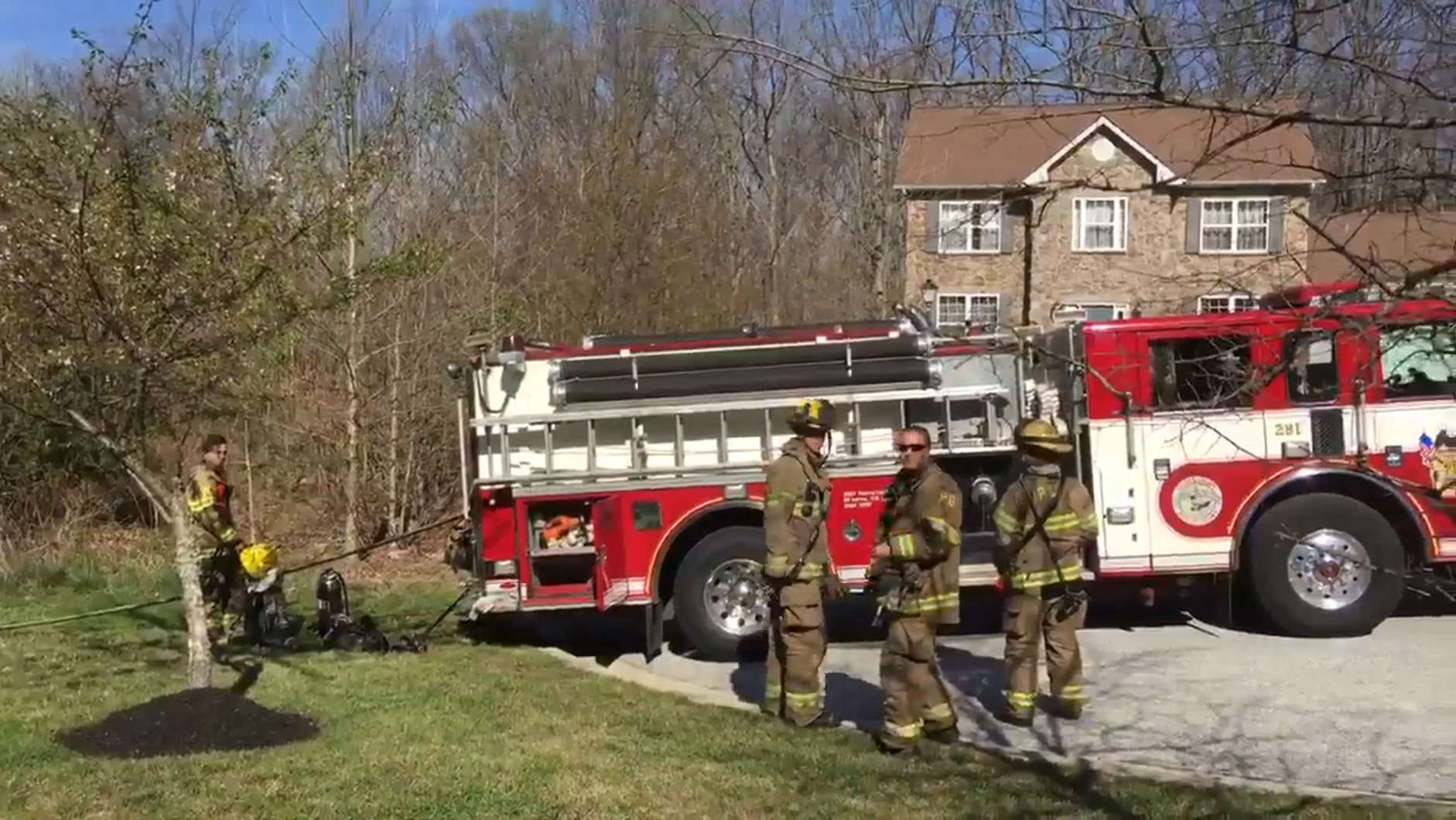 Prince George's County firefighters arrive at the scene of a fighter jet crash off Temple Hill Road in Clinton, Maryland in this screen grab from a courtesy video on April 5, 2017. (Courtesy Prince George's County Fire)
