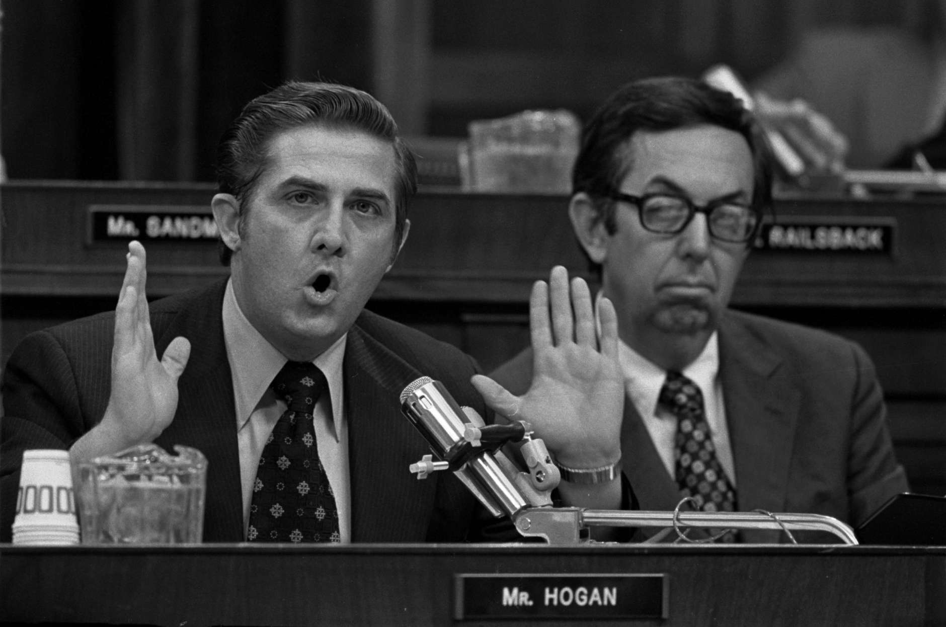 Rep. Lawrence Hogan, R-Md., left, presents his debate on the impeachment question before the House Judiciary Committee on July 25, 1974 in Washington D.C.  At right listening is Rep. Caldwell Butler, R-Va.  (AP Photo)