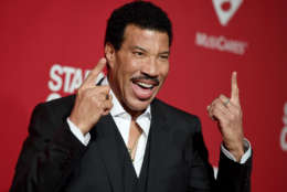 Lionel Richie arrives at the MusiCares Person of the Year tribute in his honor at the Los Angeles Convention Center on Saturday, Feb. 13, 2016. (Photo by Jordan Strauss/Invision/AP)