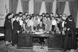 In 1948, President Harry S. Truman signed the Marshall Plan, designed to help European allies rebuild after World War II and resist communism. 

President Truman's desk is surrounded by school children from foreign countries aided by the Marshall Plan as the chief executive plays host to them during White House visit  in Washington, on Feb. 3, 1949. (AP Photo/ Harvey Georges)
