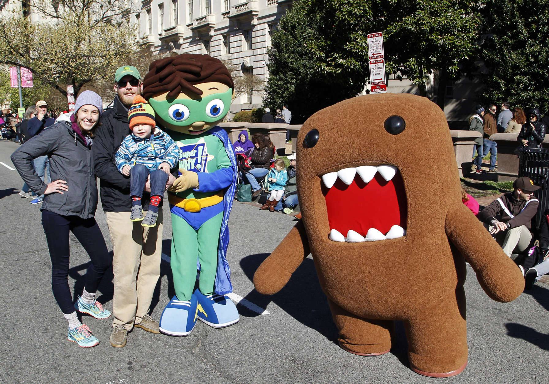 NHK WORLD TV's mascot Domo, right, and PBS Kids animated TV series character, Super Why!, left, greet fans during The National Cherry Blossom Festival Parade on Saturday, April 8, 2017 in Washington. (AP Images for NHK WORLD TV/Paul Morigi)