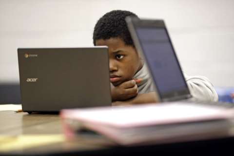 DC-area schools look to balance screens and traditional learning