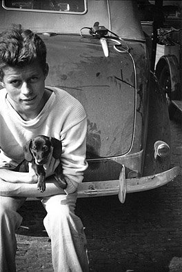 The future president holds a puppy in this August 1937 photo. (Courtesy John F. Kennedy Presidential Library and Museum)