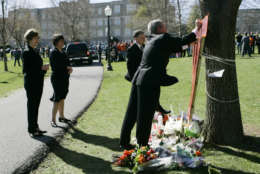 President Bush, right, accompanied by Va. Gov. Tim Kaine, ,second from right, first lady Laura Bush, left, and Kaine's wife Anne Holton, second from left, signs a memorial for Virginia Tech shooting victims, Tuesday, April 17, 2007, in Blacksburg, Va.  (AP/Gerald Herbert)