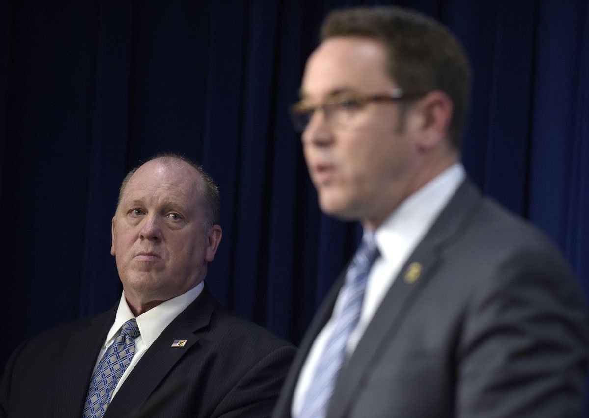 U.S. Immigration and Customs Enforcement acting director Thomas Homan, left, listens as Homeland Security Investigations deputy executive associate director Derek Benner, right, speaks during a news conference in Washington, Thursday, May 11, 2017, to announce the results of a national operation targeting gang members and associates. (AP Photo/Susan Walsh)