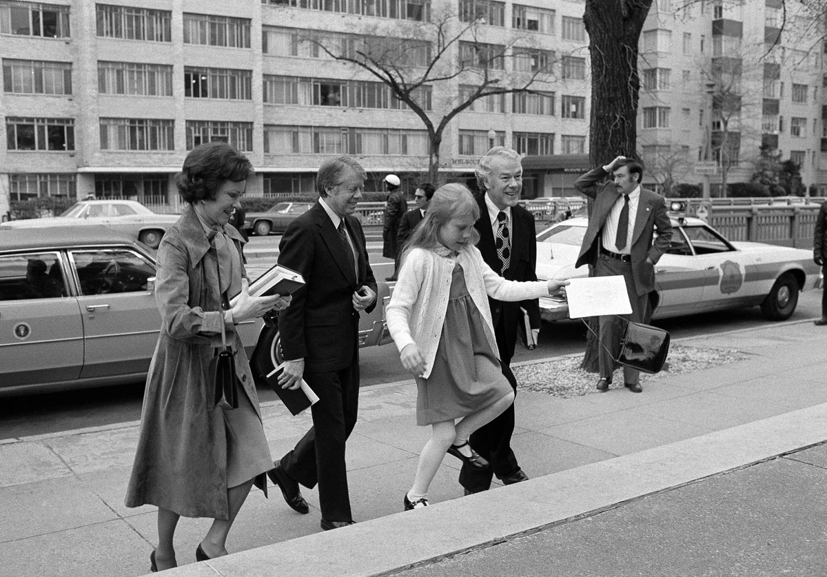 Amy Carter skips up the steps of First Baptist Church in D.C. with President Jimmy Carter and firsty lady Rosalynn Carter in March 1977. Amy famously attended public schools in D.C. during her father's term as president, including the historic African American elementary school Stevens Elementary. (AP photo)