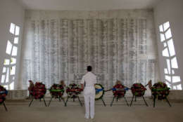 PEARL HARBOR, HAWAII - DECEMBER 7:   Vice Admiral Michael Vitale pauses for a moment in the shrine room of the USS Arizona Memorial during a memorial service for the 69th anniversary of the attack on the U.S. naval base at Pearl Harbor on the island of Oahu on December 7, 2010 in Pearl Harbor, Hawaii. On the morning of December 7, 1941 a surprise military attack was conducted by aircraft of the Imperial Japanese Navy against the U.S. Pacific Fleet being moored in Pearl Harbor becoming a major catalyst for the United States entering World War II.  In the devastating attack over 2,400 people were killed and thousands wounded, and dozens of Navy vessels with were either sunk or destroyed. (Photo by Kent Nishimura/Getty Images)