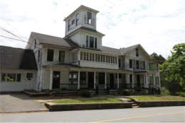 The collection of quaint but somewhat-neglected Victorian-style buildings includes an old-time general store, post office, a mill and a covered brdige. The village of Johnsonville was supposed to be a tourist attraction but now sits abandoned. The asking price is $1.9 million. (Courtesy Raveis Real Estate)