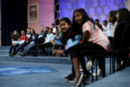 The finalists in the 90th Scripps National Spelling Bee react as they watch an opening video featuring past bee participants in Oxon Hill, Md., Thursday, June 1, 2017. (AP Photo/Jacquelyn Martin)