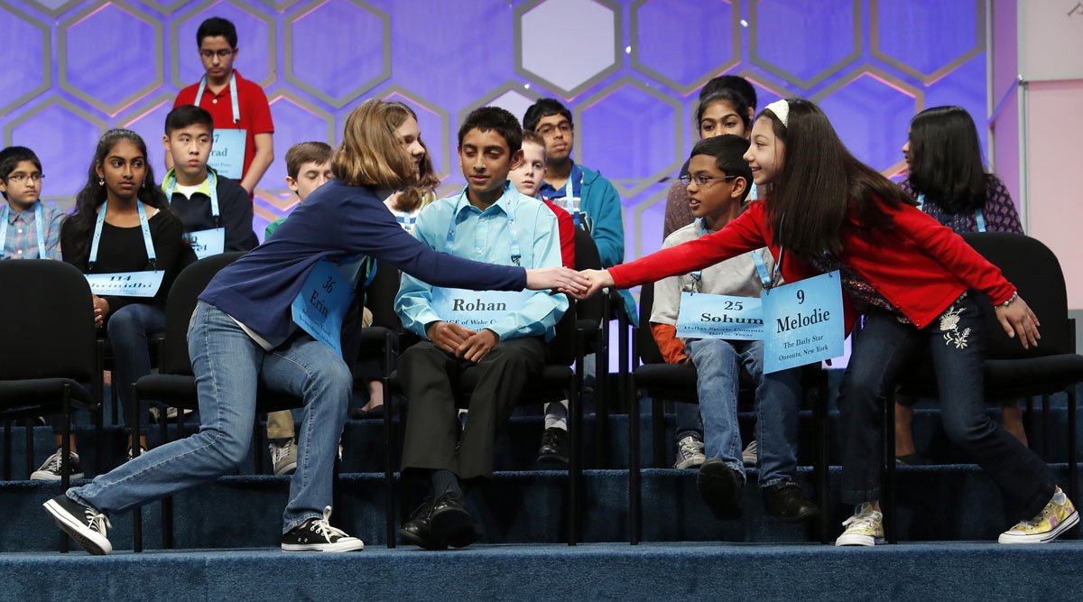 Erin Howard, 12, from Huntsville, Ala., left and Melodie Loya, 12, from Bainbridge, N.Y., right, react after spelling during the finals of the 90th Scripps National Spelling Bee, Thursday, June 1, 2017, in Oxon Hill, Md. (AP Photo/Alex Brandon)