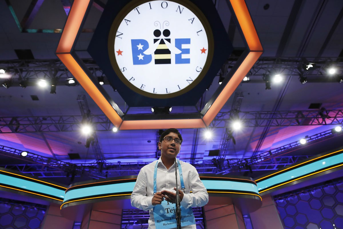 Tejas Muthusamy, 14, of Glen Allen, Va., spells his word in the 90th Scripps National Spelling Bee in Oxon Hill, Md., Thursday, June 1, 2017. (AP Photo/Jacquelyn Martin)