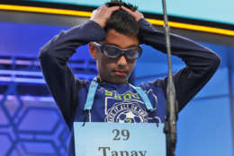 Tanay Nandan, 10, from Short Hills, N.J., thinks about his word in the third round of the 90th Scripps National Spelling Bee, Wednesday, May 31, 2017, in Oxon Hill, Md. Nandan spelled his word correctly. (AP Photo/Alex Brandon)