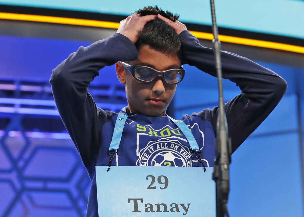 Tanay Nandan, 10, from Short Hills, N.J., thinks about his word in the third round of the 90th Scripps National Spelling Bee, Wednesday, May 31, 2017, in Oxon Hill, Md. Nandan spelled his word correctly. (AP Photo/Alex Brandon)