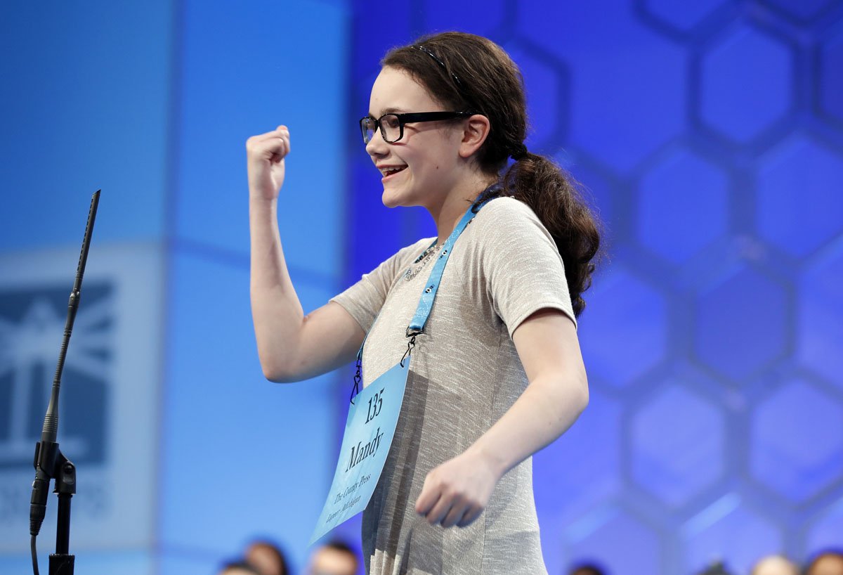 Mandy Granz, 12, from Imlay City, Mich. reacts after correctly spelling her word in the third round of the 90th Scripps National Spelling Bee, Wednesday, May 31, 2017, in Oxon Hill, Md. (AP Photo/Alex Brandon)
