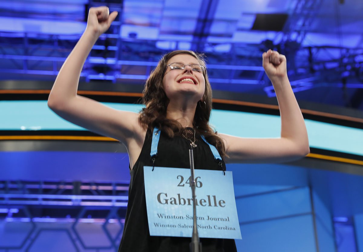 Gabrielle Brown, 14, of Salisbury, N.C., reacts after spelling her word correctly in the third round of the 90th Scripps National Spelling Bee, Wednesday, May 31, 2017, in Oxon Hill, Md. (AP Photo/Alex Brandon)
