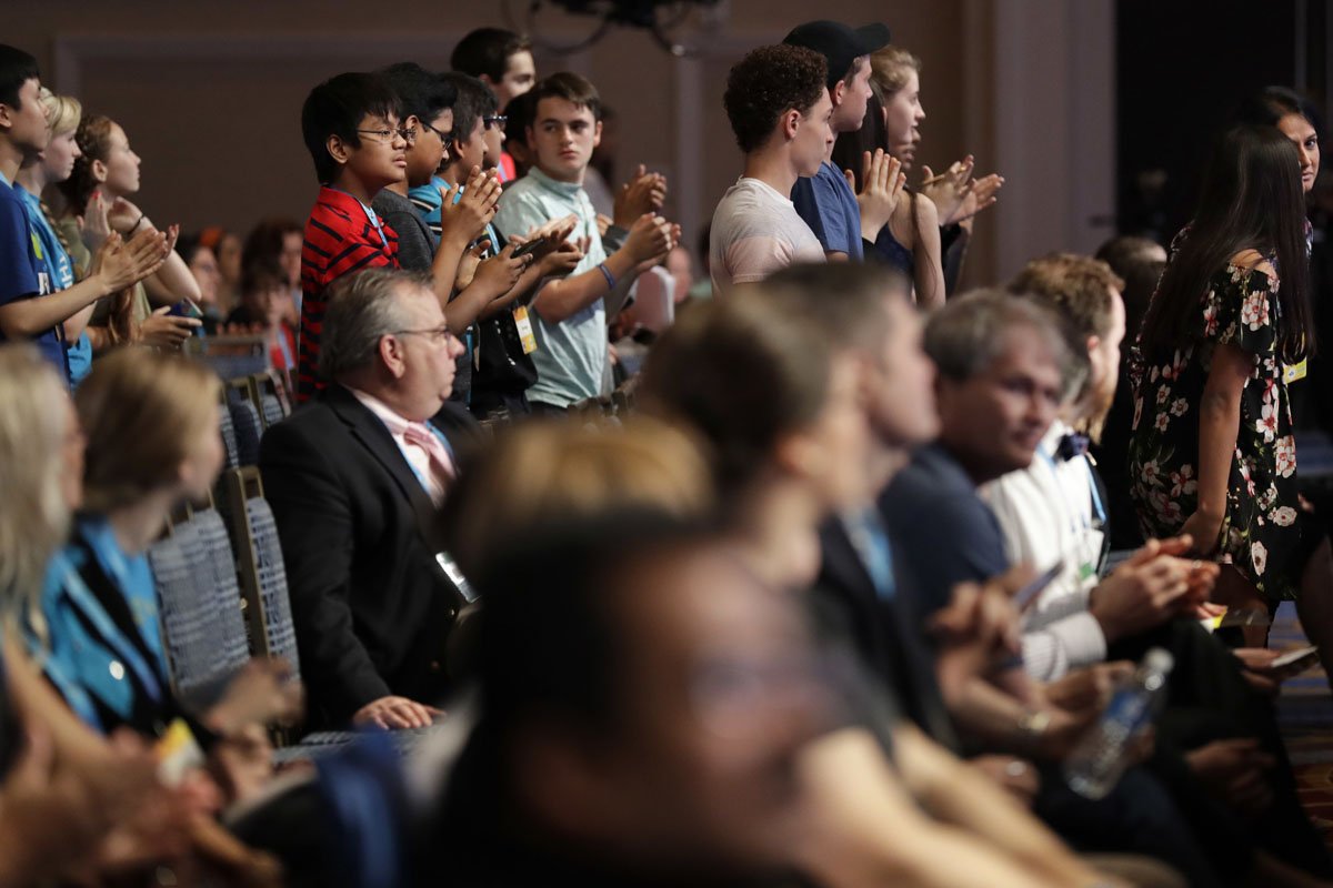 Members of the audience stand up and applaud Siyona Mishra, 13, of Orlando, Fla., after she spelled her word incorrectly as a finalist in the 90th Scripps National Spelling Bee in Oxon Hill, Md., Thursday, June 1, 2017. (AP Photo/Jacquelyn Martin)
