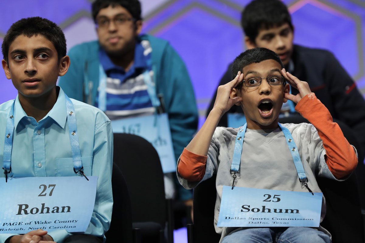 Sohum Sukhatankar, 11, of Allen, Texas, right, takes a moment during a break in competition at the 90th Scripps National Spelling Bee in Oxon Hill, Md., Thursday, June 1, 2017. At left is Rohan Sachdev, 14, from Cary, North Carolina. (AP Photo/Jacquelyn Martin)