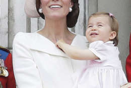 In this Saturday, June 11, 2016 file photo, Britain's Kate, Duchess of Cambridge, holding Princess Charlotte on the balcony during the Trooping The Colour parade at Buckingham Palace, in London. It's nearly party time for Britain's Princess Charlotte, who celebrates her 2nd birthday on Tuesday.  (AP Photo/Tim Ireland, File)