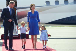 Britain's Prince William, left, Kate, the Duchess of Cambridge and their children Prince George and Princess Charlotte arrive at the airport in Berlin, Wednesday, July 19, 2017. The British royal couple is on a three-day-visit in Germany. (Steffi Loos/Pool Photo via AP)