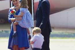 Britain's Prince William, and his wife Kate, the Duchess of Cambridge with their children Prince George and Princess Charlotte arrive at the airport in Berlin, Wednesday, July 19, 2017. The British royal couple is on a three-day-visit in Germany. (Steffi Loos/Pool Photo via AP)