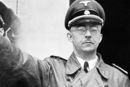 FILE - The undated file photo shows German Nazi party official and head of the SS, Heinrich Himmler. at unknown location in Germany. German newspaper Welt am Sonntag has published a trove of letters believed to be written by Nazi SS leader Heinrich Himmler. On seven full pages the paper on Sunday Jan. 26,2014  showed pictures of Himmler and his family smiling into the camera during a fishing trip, the top Nazi taking a bath in a lake or feeding a little fawn. The newspaper, which says the material is contained in an eight-part series it plans to publish, also quotes excerpts from Himmler's love letters addressing his wife as "my sweet, beloved little woman." Welt said it worked together with Israeli film director Vanessa Lapa, whose family had the documents in its possession.  (AP Photo/str/file)