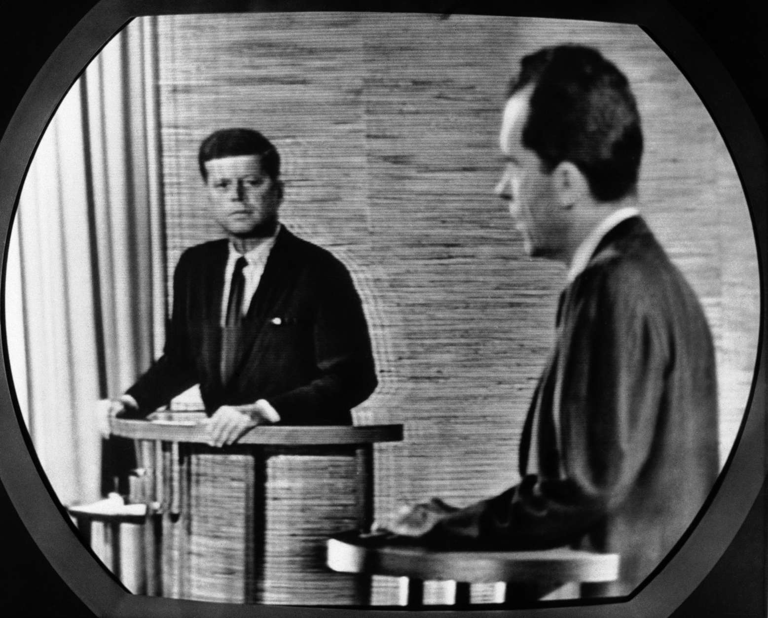 Vice President Richard Nixon, right, talks and Sen. John F. Kennedy listens in this view taken from television screen in New York, Oct. 7, 1960. The debate between the presidential candidates was broadcast nationally on TV and radio from Washington studio. (AP Photo)
