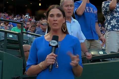 President Bush photobombs reporter at Rangers game